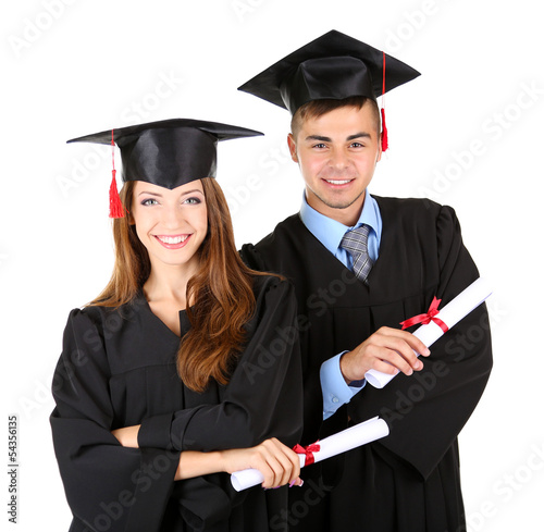Photo: Two happy graduating students isolated on white Two happy graduating students isolated on white