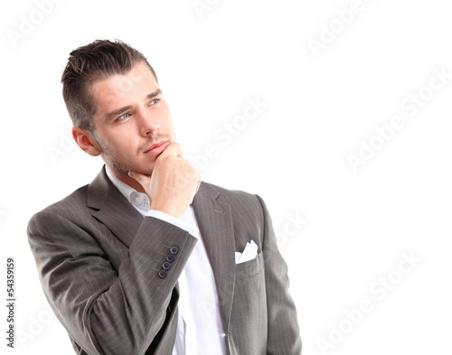 Photo: Young handsome man looking at copy-space thinking or dreaming Young handsome man looking at copy-space thinking or dreaming