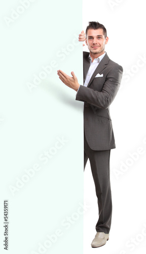 Photo: Happy business man presenting with copy space for your text Happy business man presenting with copy space for your text