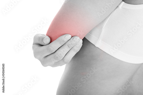 Photo: Woman with elbow pain Woman with elbow pain