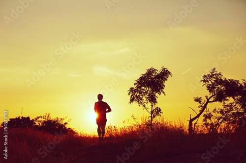 Photo: Running at the sunset - back lit Running at the sunset - back lit