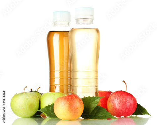 Photo: two bottles of juice with sweet apples, isolated on white two bottles of juice with sweet apples, isolated on white