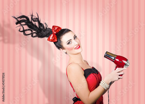 Photo: Fashion model straightening long brunette hair Fashion model straightening long brunette hair