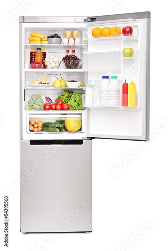 Photo: Studio shot of an open fridge full of healthy food products Studio shot of an open fridge full of healthy food products
