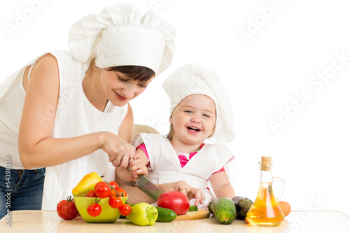 Photo: Chef mom and kid preparing healthy food Chef mom and kid preparing healthy food