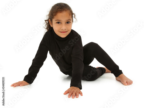 Photo: Beautiful Hispanic Preschooler barefoot on white floor with clip Beautiful Hispanic Preschooler barefoot on white floor with clip
