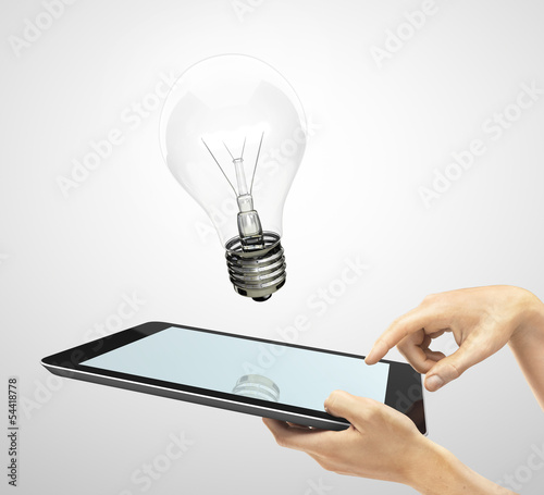 Photo: tablet and lightbulb tablet and lightbulb