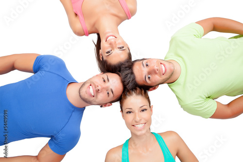 Photo: Happy friends on the floor with their heads together Happy friends on the floor with their heads together