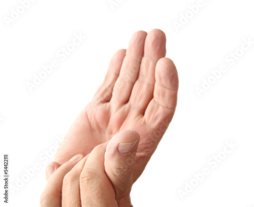 Photo: older man has sore thumb older man has sore thumb