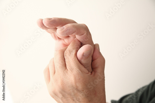 Photo: thumb pain in senior man thumb pain in senior man