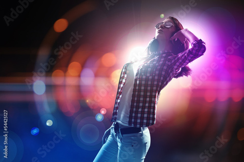 Photo: Young girl listens to music Young girl listens to music
