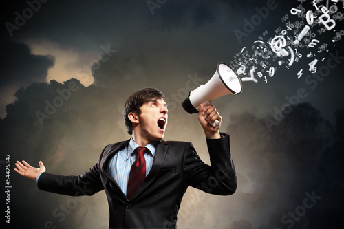 Photo: businessman with megaphone businessman with megaphone