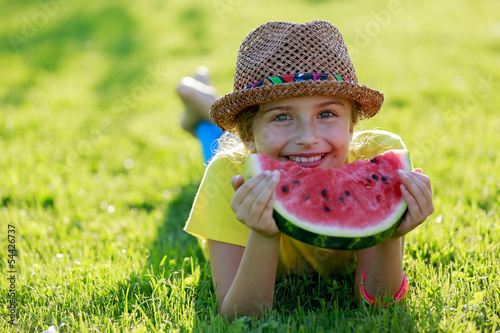 Photo: Summer joy - happy girl eating fresh watermelon Summer joy - happy girl eating fresh watermelon