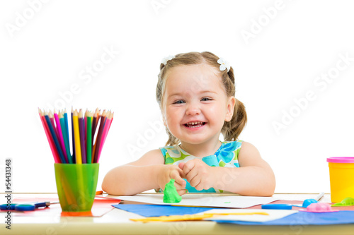 Photo: happy kid drawing and making by hands happy kid drawing and making by hands