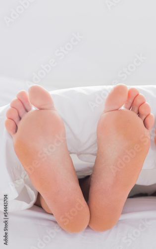 Photo: Feet sticking out from the quilt Feet sticking out from the quilt