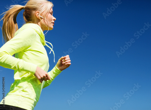 Photo: woman doing running outdoors woman doing running outdoors