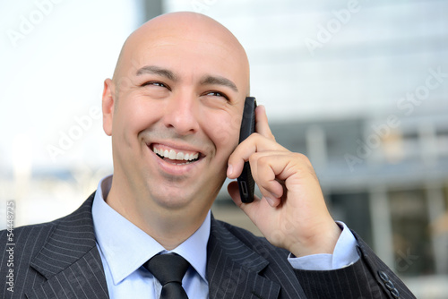 Photo: Manager felice al telefono Manager felice al telefono