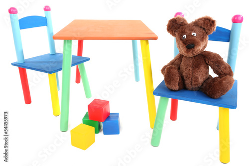 Photo: Small and colorful table and chairs for little kids isolated Small and colorful table and chairs for little kids isolated