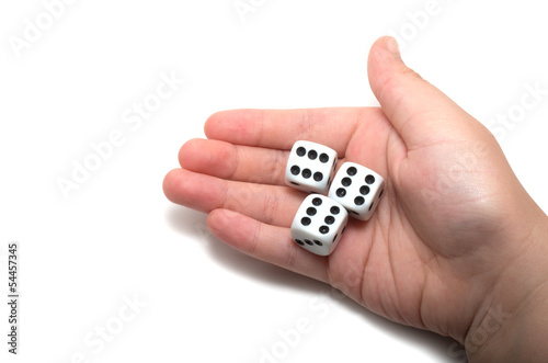 Photo: Hand holding three dices Hand holding three dices