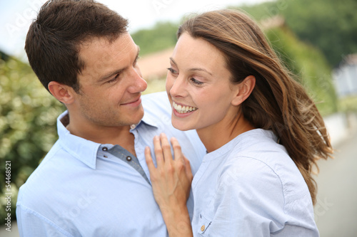 Photo: Portrait of cheerful and lovely couple Portrait of cheerful and lovely couple