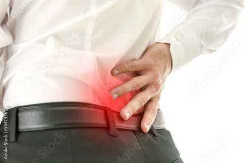Photo: Detail of man suffering from back pain Detail of man suffering from back pain