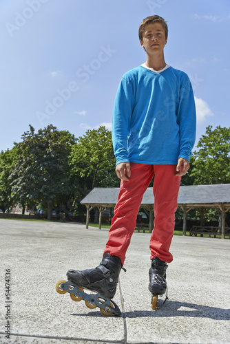 Photo: Active young people - teenager rollerblading Active young people - teenager rollerblading