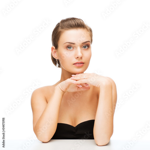 Photo: woman with earrings and wedding ring woman with earrings and wedding ring