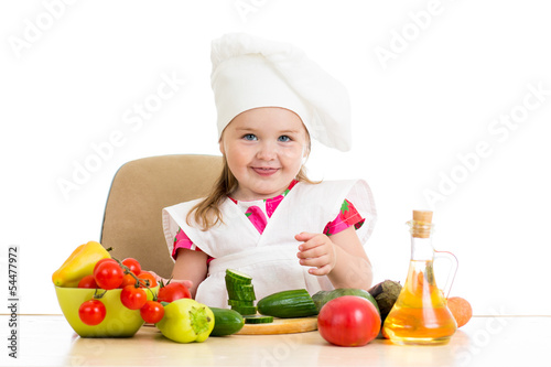 Photo: Chef kid preparing healthy food Chef kid preparing healthy food