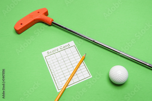 Photo: Mini Golf club with score card, ball and pencil Mini Golf club with score card, ball and pencil