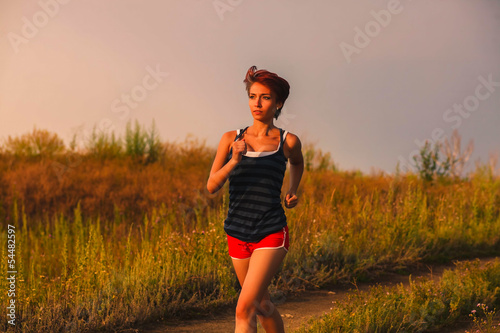 Photo: beautiful a healthy runs young brunette woman athlete running ou beautiful a healthy runs young brunette woman athlete running ou