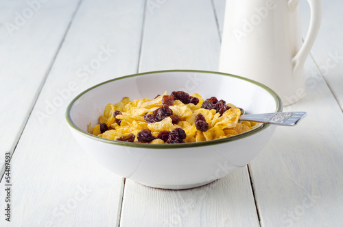 Photo: Bowl of Cornflakes and Milk Jug Bowl of Cornflakes and Milk Jug