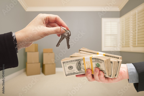 Photo: Agent Handing Over Cash and House Keys Agent Handing Over Cash and House Keys