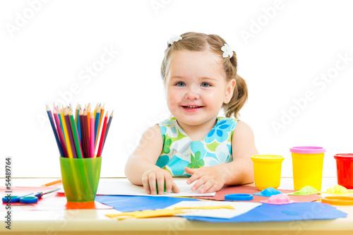 Photo: kid girl drawing and making by hands kid girl drawing and making by hands