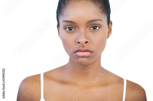 Photo: Unsmiling woman looking at camera Unsmiling woman looking at camera