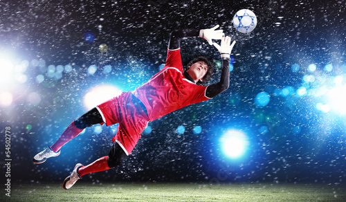 Photo: Goalkeeper catches the ball Goalkeeper catches the ball