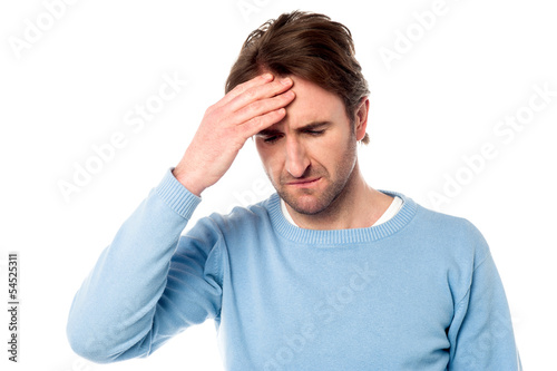 Photo: Man having severe headache Man having severe headache