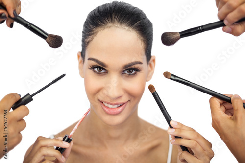 Photo: Beautiful woman encircled by make up brushes Beautiful woman encircled by make up brushes