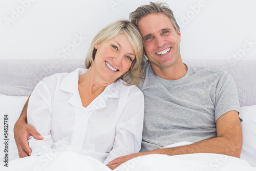 Photo: Happy couple in bed Happy couple in bed