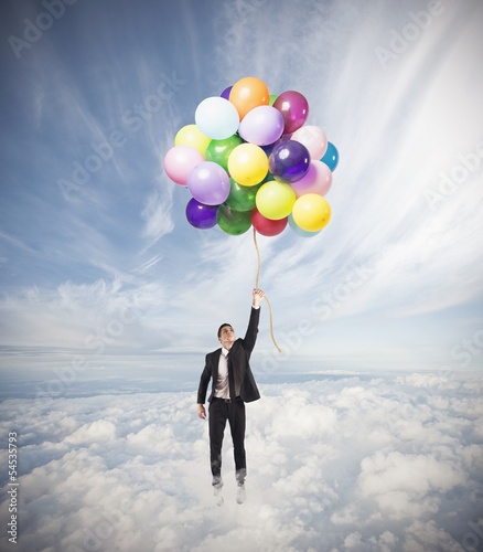 Photo: Businessman flying high Businessman flying high