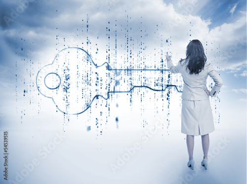 Photo: Businesswoman drawing a key Businesswoman drawing a key