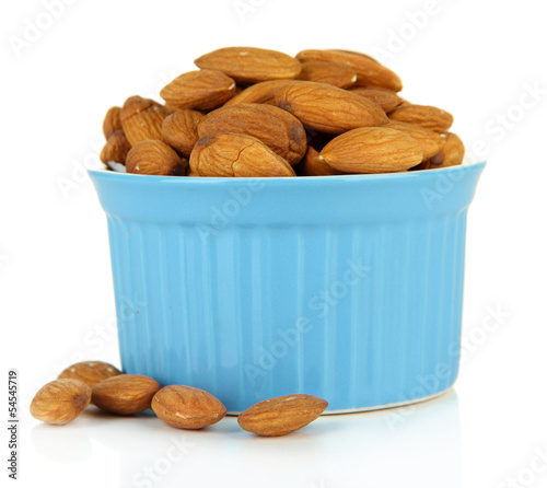 Photo: Almond in bowl, isolated on white Almond in bowl, isolated on white