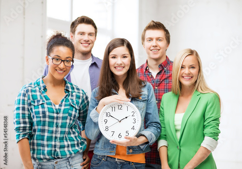 Photo: group of students at school with clock group of students at school with clock