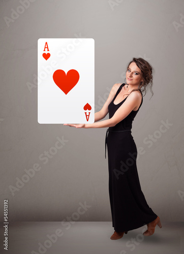Photo: Beautifu woman holding a red heart ace Beautifu woman holding a red heart ace