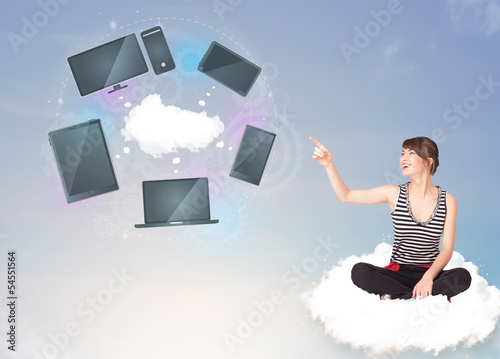 Photo: Young girl sitting on cloud enjoying cloud network service Young girl sitting on cloud enjoying cloud network service