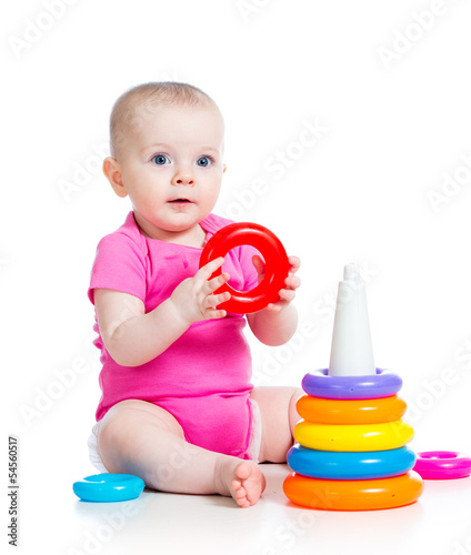 Photo: happy baby girl playing toy isolated on white happy baby girl playing toy isolated on white