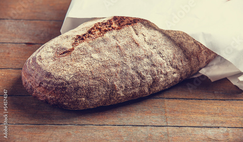 Photo: Delicious bread on a wood table Delicious bread on a wood table