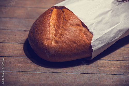 Photo: Delicious bread on a wood table Delicious bread on a wood table