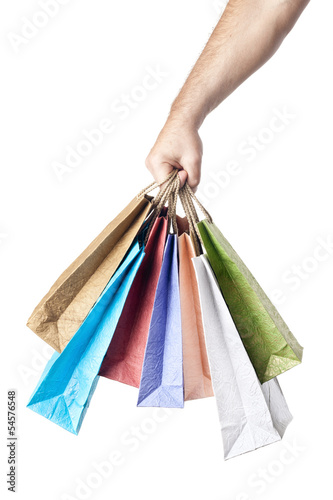 Photo: male hand holding shopping bags isolated on white background male hand holding shopping bags isolated on white background