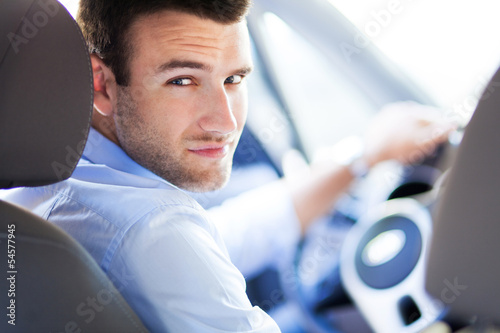 Photo: Man driving a car Man driving a car