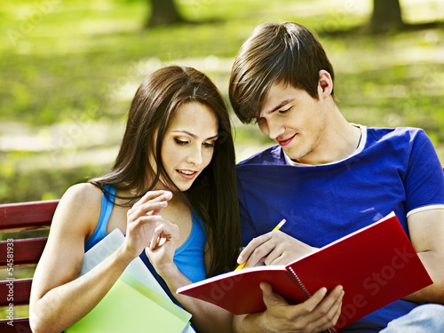 Photo: Couple student with notebook outdoor. Couple student with notebook outdoor.